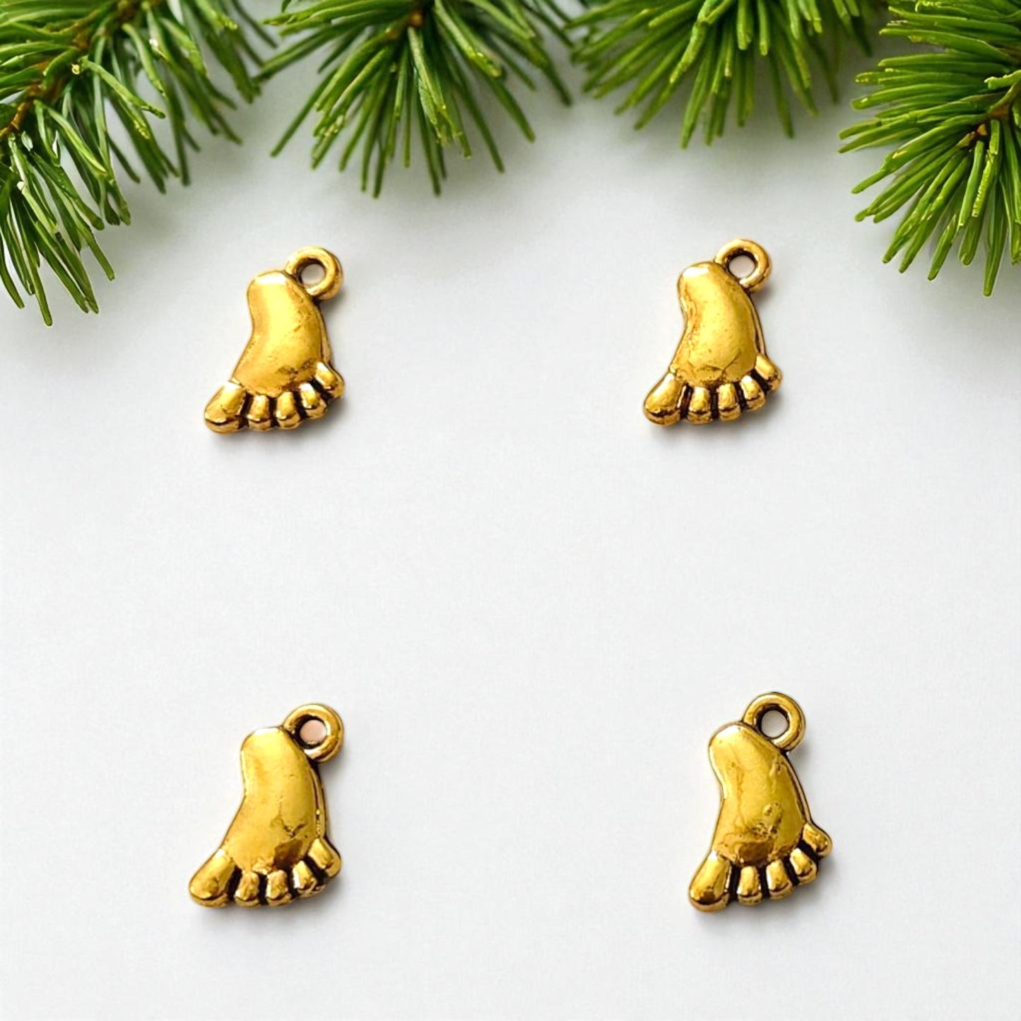 Gold baby foot charm for jewelry making and craft projects
