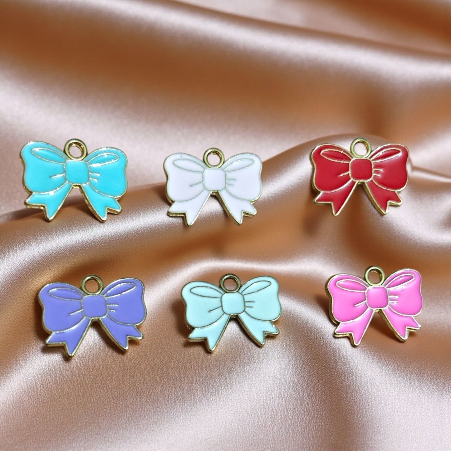 Bow enamel charms in vibrant colors for jewelry making and craft projects