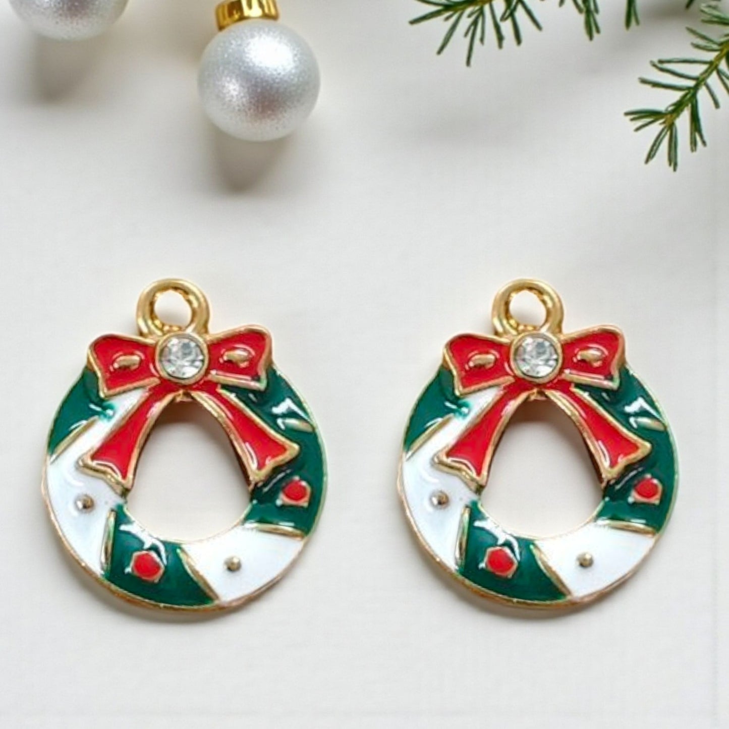 Christmas wreath charms with festive green and red detailing, perfect for holiday jewellery and DIY crafting.