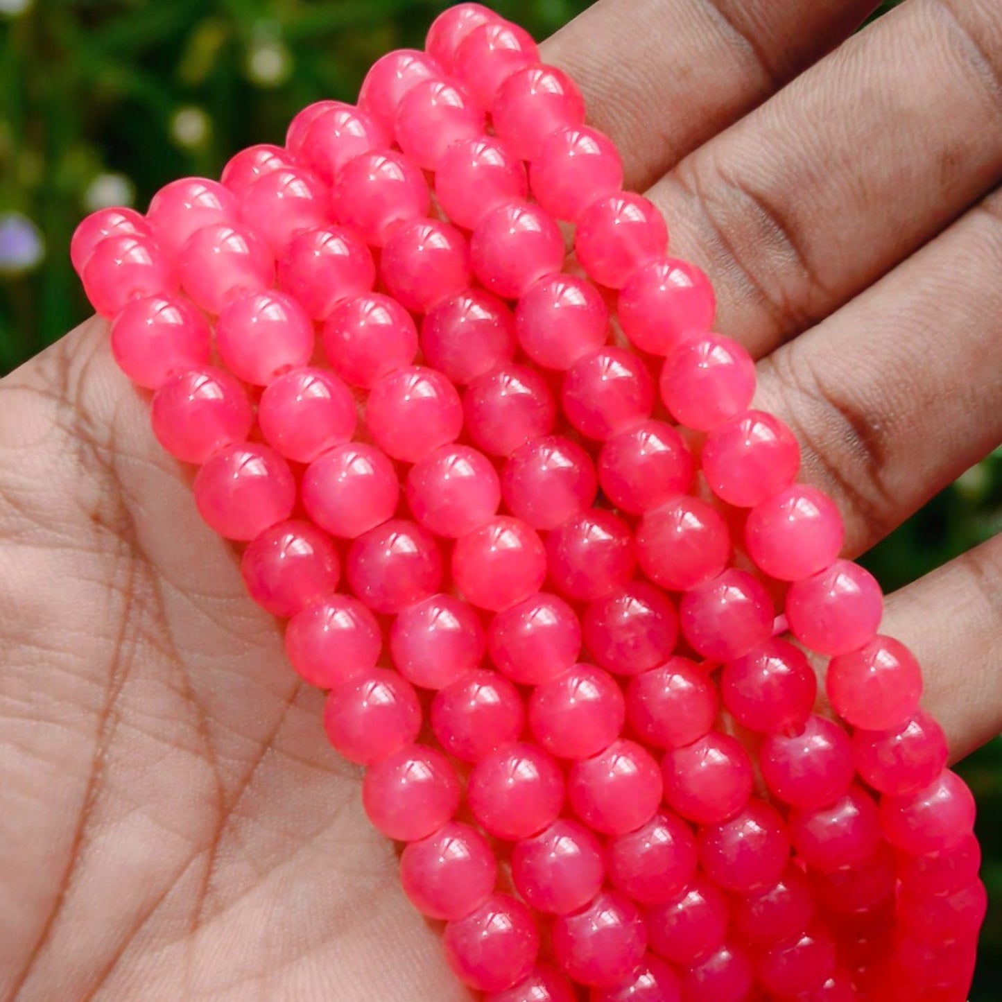 Smooth, semi-transparent jelly beads in a rich dark peach shade, featuring a shiny, gel-like appearance perfect for vibrant accessories and beading projects.