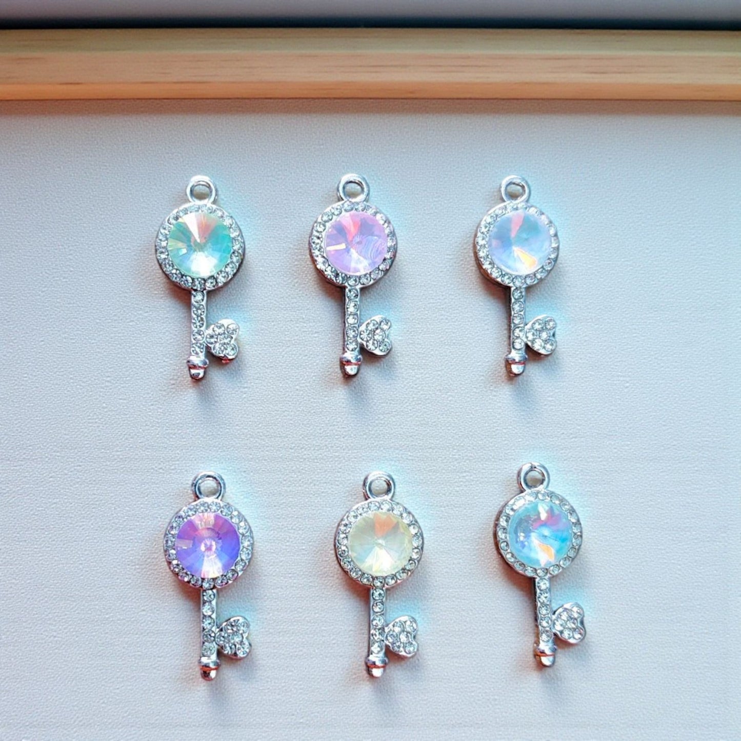 Luxury Key Shimmering Stone Charm with sparkling crystal detailing.