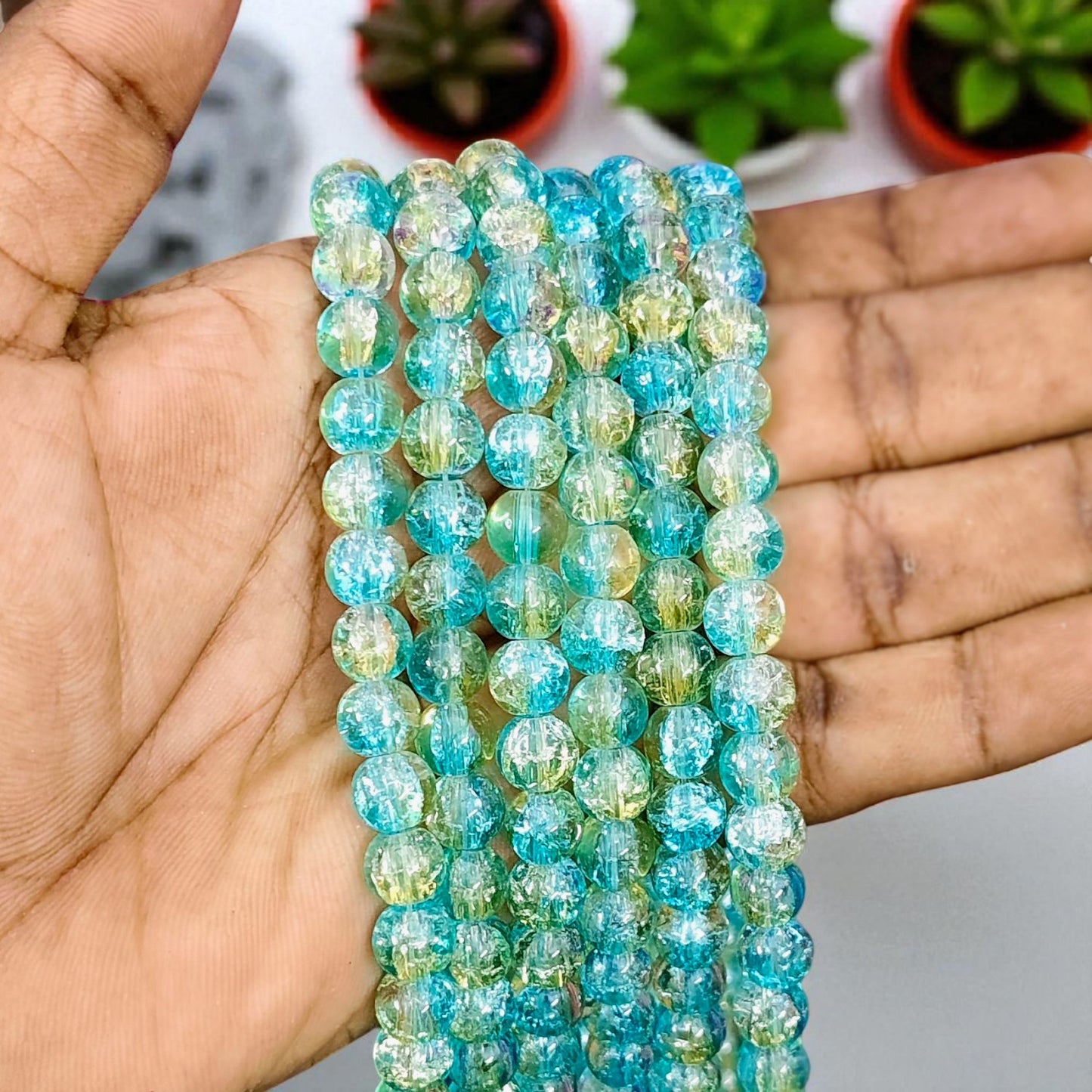 Sky blue and gold multi crackle beads with a shimmering crackled finish, ideal for jewelry making and craft projects.