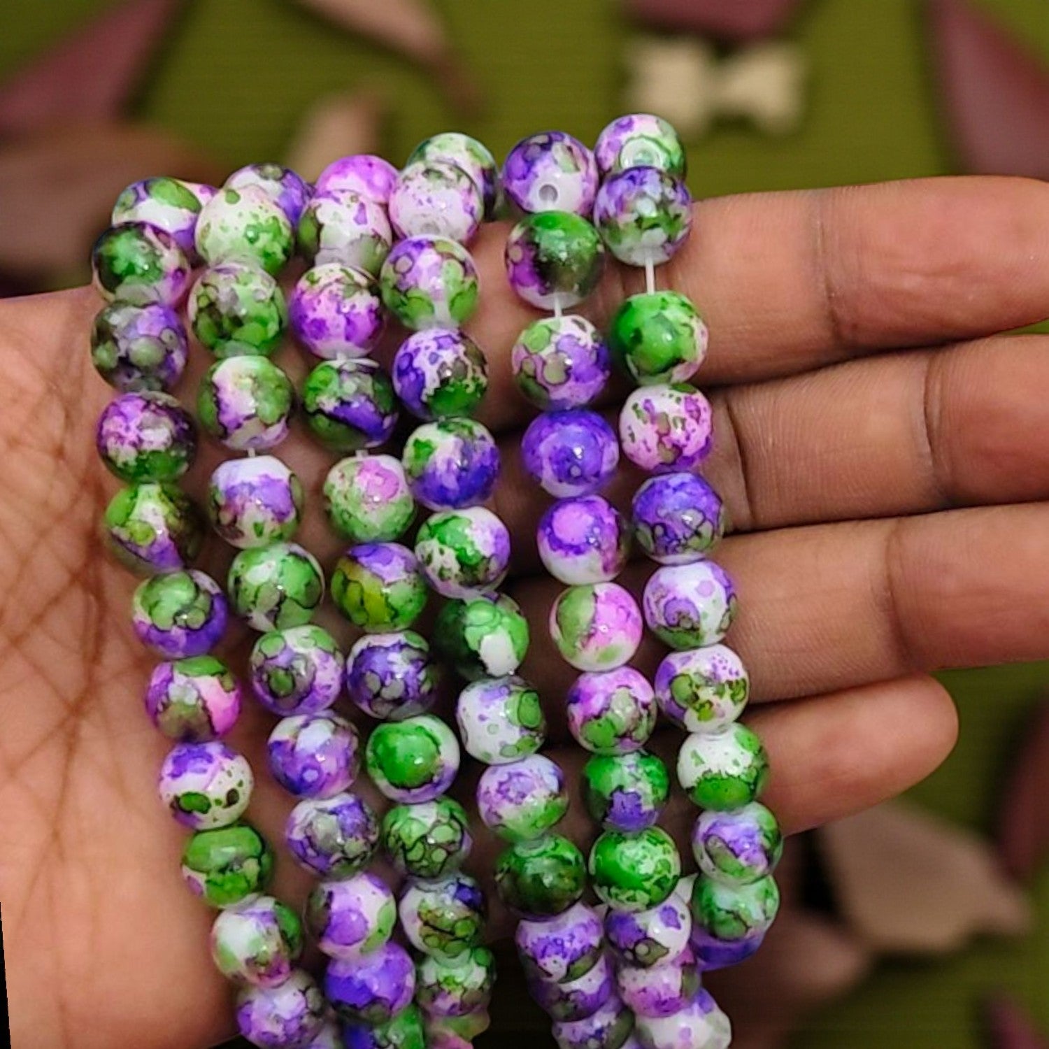 8mm green beads with purple printed design for jewellery making and craft projects