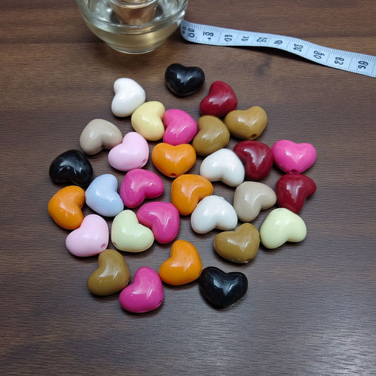 Acrylic heart beads in assorted colors for DIY jewelry and craft making.