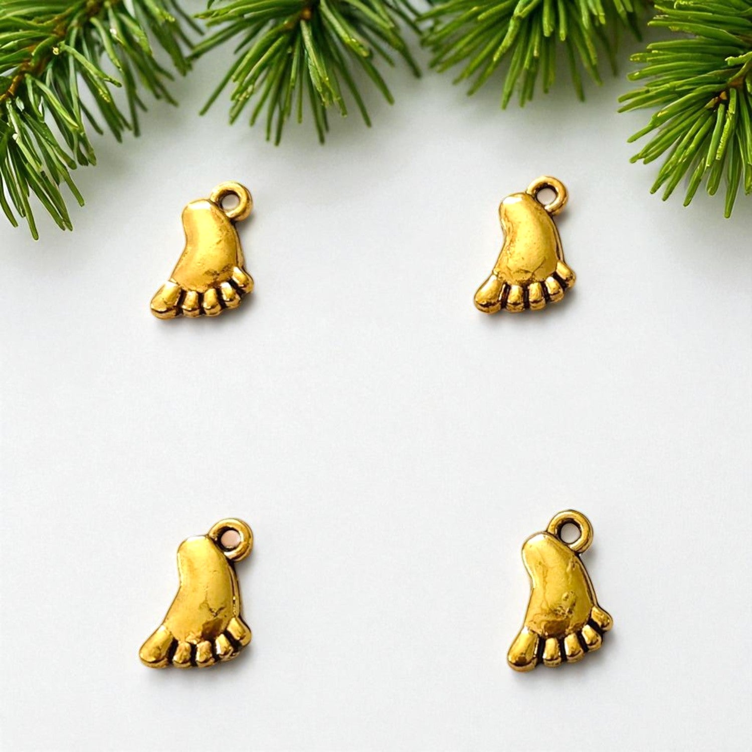 Gold baby foot charm for jewelry making and craft projects