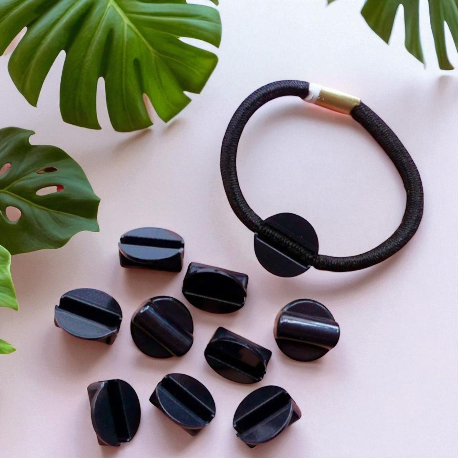 Stretchable hair band with connectors for easy DIY accessory making and secure hair styling.