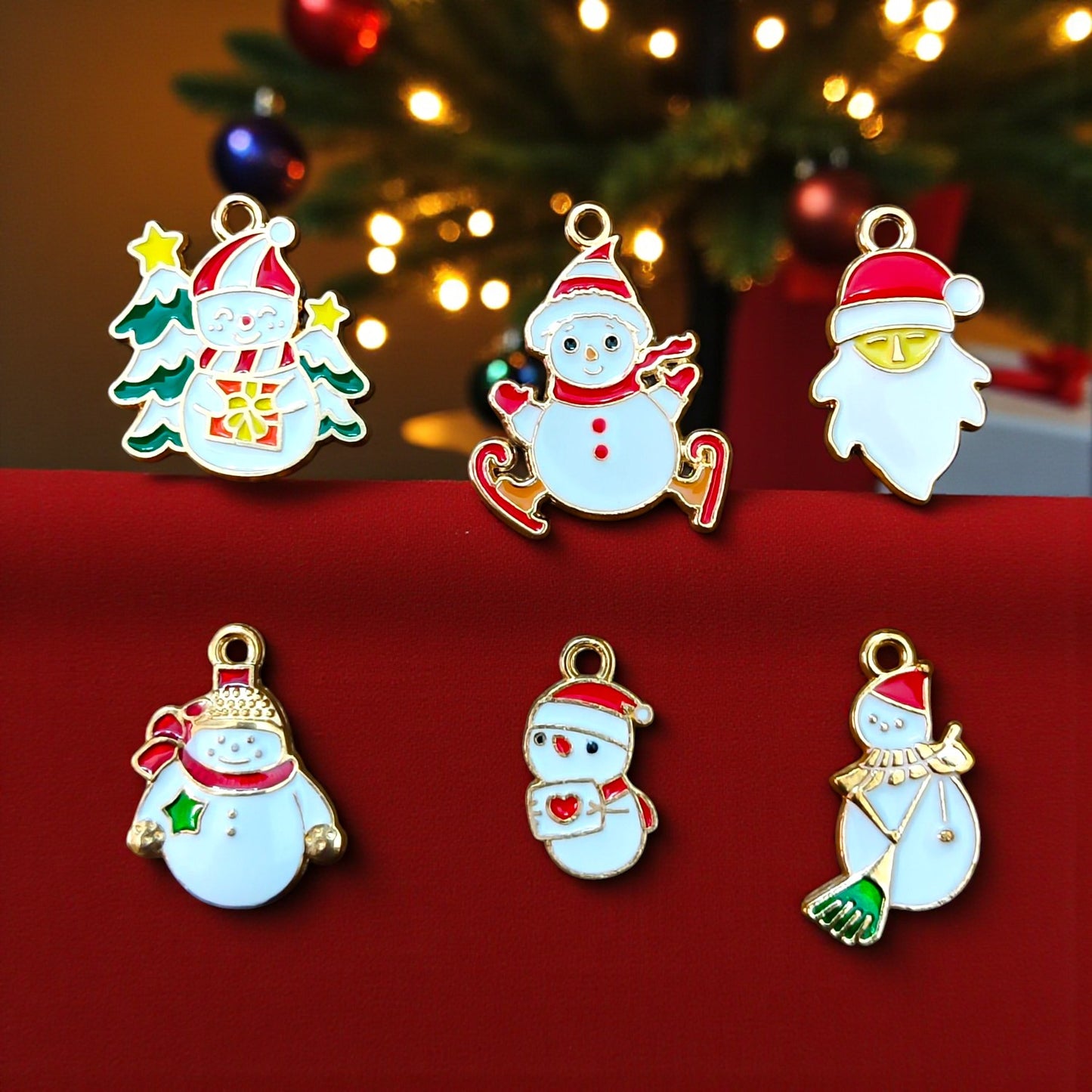 Cute Christmas Snowman Charms with colorful enamel details for festive jewelry and DIY crafts