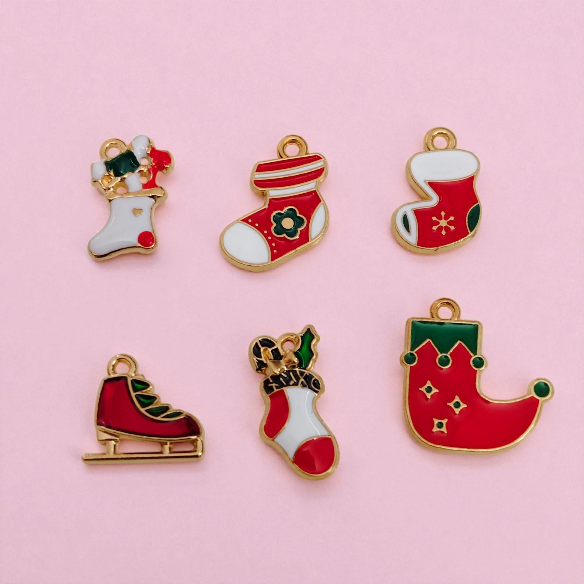 Red and green Christmas stocking charms with festive detailing for bracelet and jewellery making