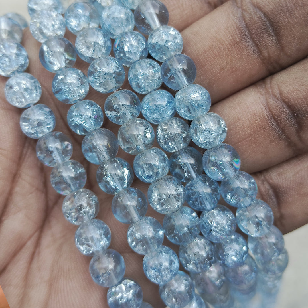 Elegant 8mm crackle beads in light navy blue, ideal for DIY jewelry, bracelets, and craft projects with a stylish crackled finish.