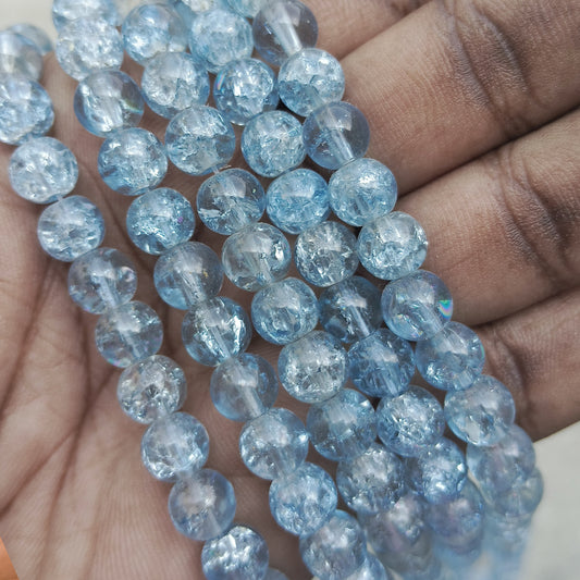 Elegant 8mm crackle beads in light navy blue, ideal for DIY jewelry, bracelets, and craft projects with a stylish crackled finish.