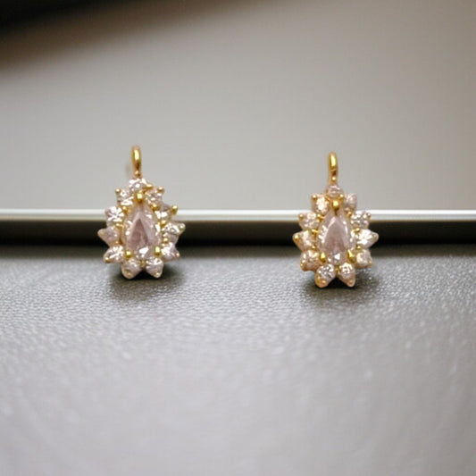 Small water drop-shaped pendant adorned with crystal-clear AD stones, perfect for elegant jewelry designs.