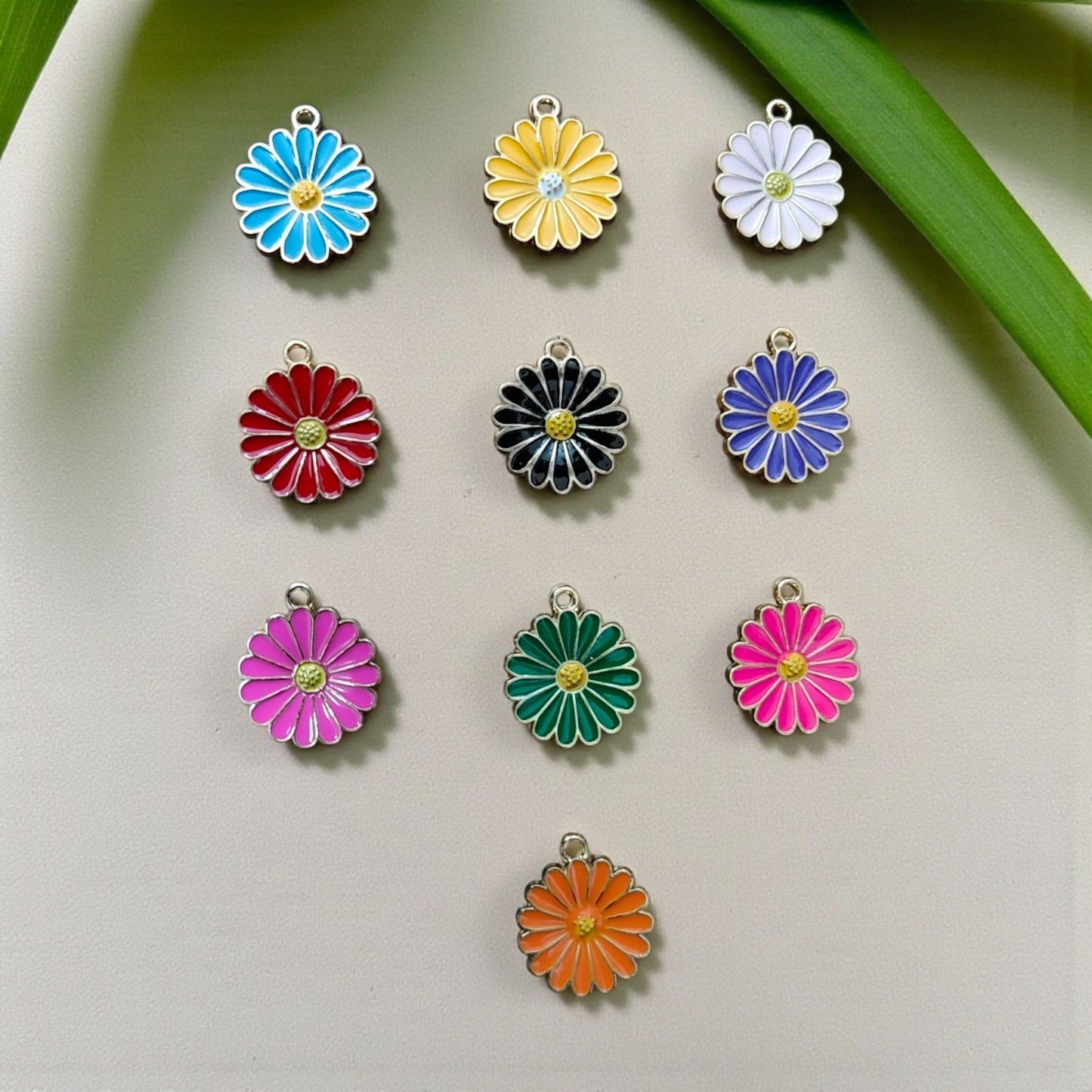 Cute daisy flower shaped charms for DIY bracelets, phone charms and accessories.