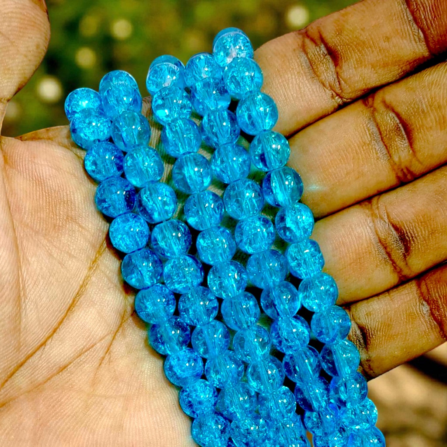 Dark blue crackle beads with glossy finish, ideal for DIY jewelry, bracelets, and craft projects.