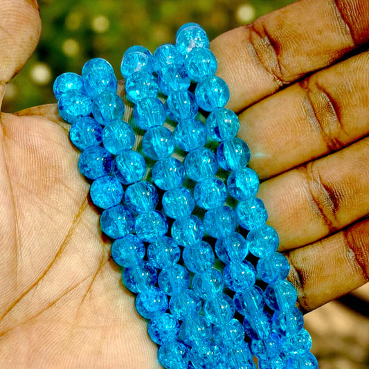 Dark blue crackle beads with glossy finish, ideal for DIY jewelry, bracelets, and craft projects.