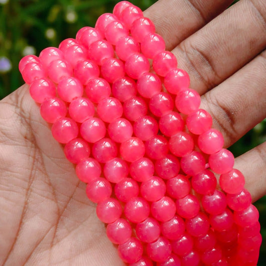 Smooth, semi-transparent jelly beads in a rich dark peach shade, featuring a shiny, gel-like appearance perfect for vibrant accessories and beading projects.
