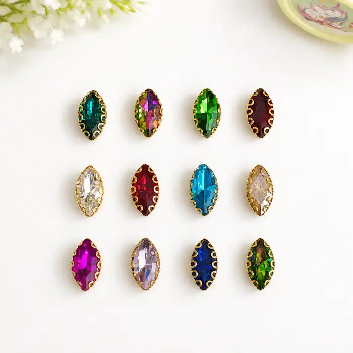 Eye Shape Clip Stone with faceted surface and gold-tone border in assorted colours