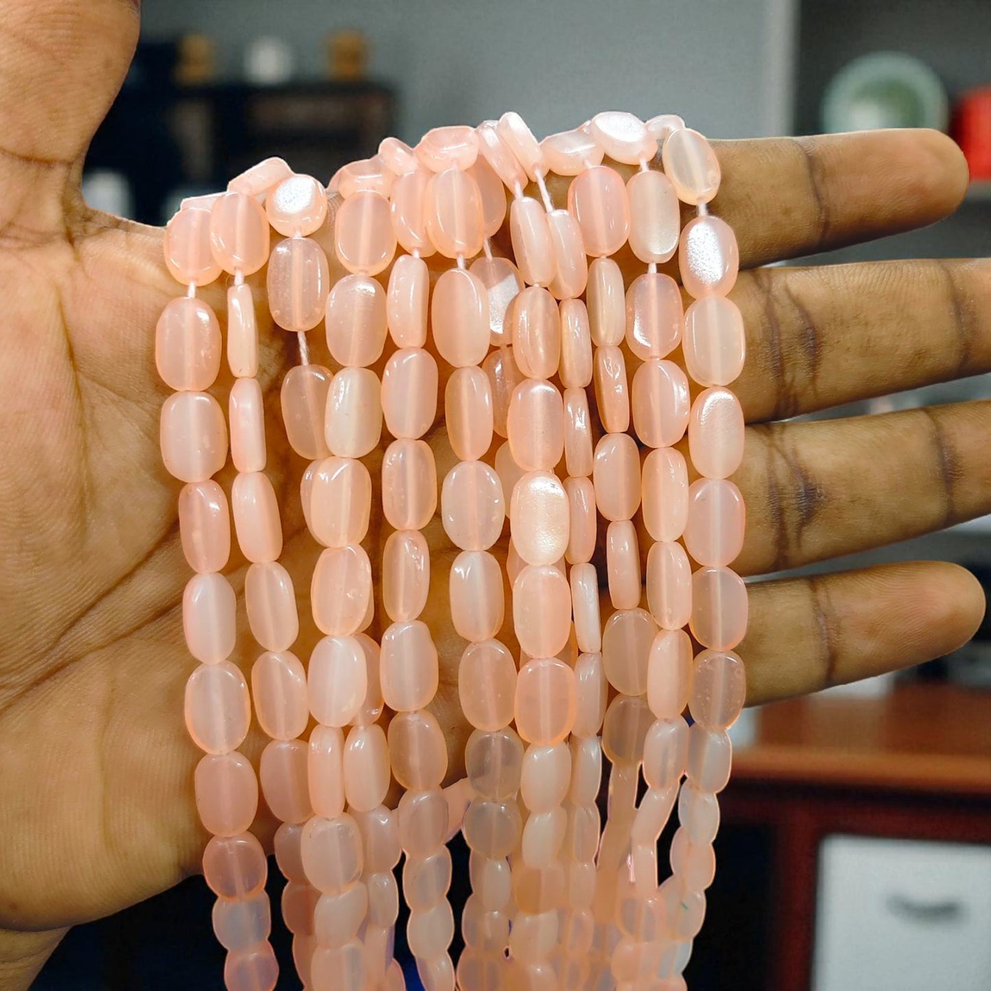 Light peach tablet beads with a smooth flat design, ideal for jewelry making and creative craft designs.