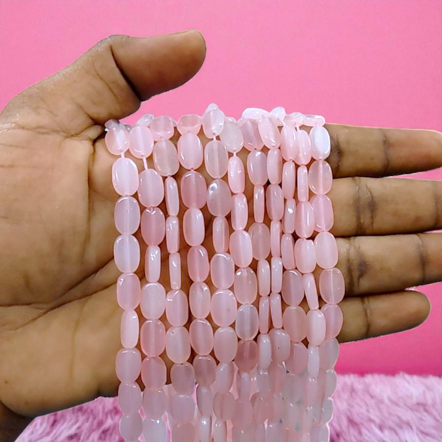 Light pink tablet beads with a smooth flat design, ideal for jewelry making and creative craft projects.
