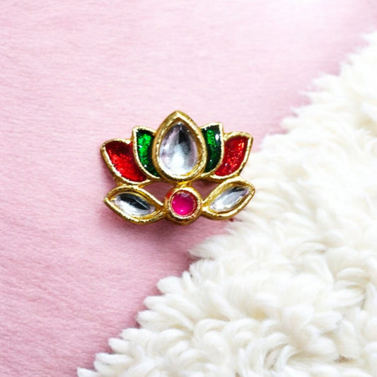 Lotus-shaped Kundan stone with a polished finish and gold-toned setting, ideal for traditional Indian jewelry.