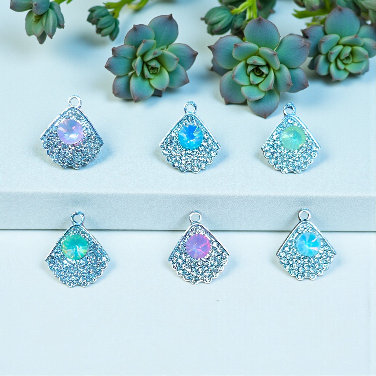 Luxury Leaf Shimmering Stone Charm with elegant leaf design and sparkling stones.