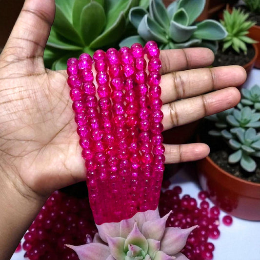 Magenta crackle beads with a glossy cracked-glass effect for jewelry making and DIY crafts
