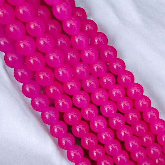 Bright magenta jelly beads with a gel-like, luminous finish, adding a bold pop of color to handmade jewelry designs.