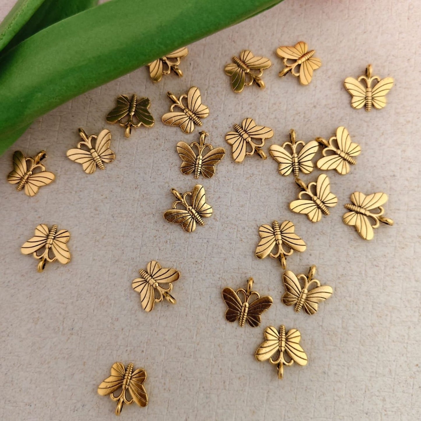 Gold metal butterfly charm with shiny finish for jewellery making, DIY bracelets, earrings and craft projects