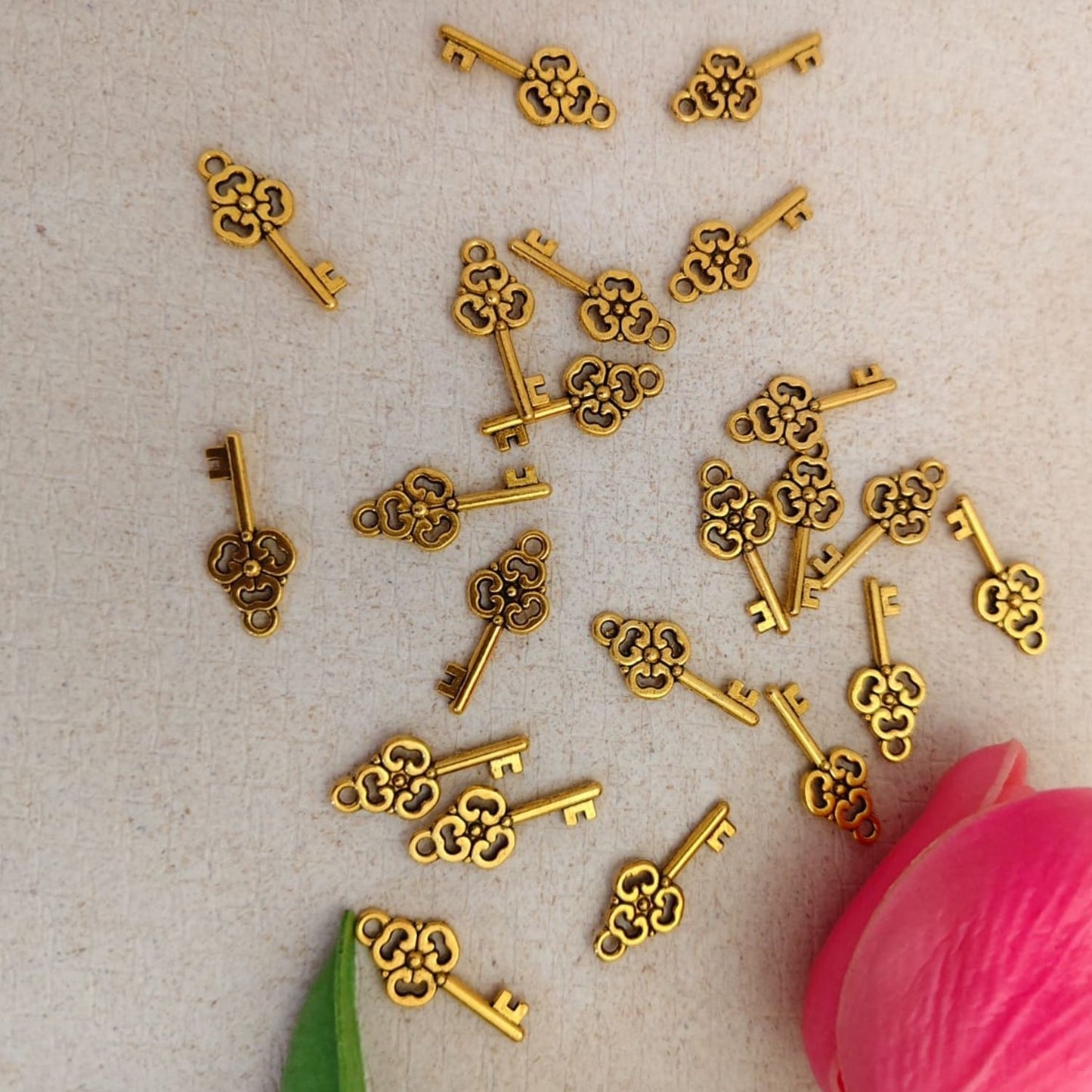 Gold key metal charm with shiny finish for jewellery making and DIY crafts by Eva Fashion and Craft