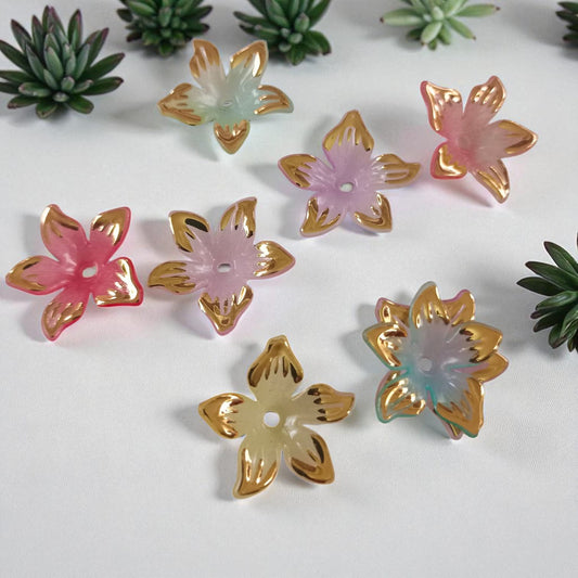 Multicolor acrylic flower beads with gold border for elegant jewelry and craft making.