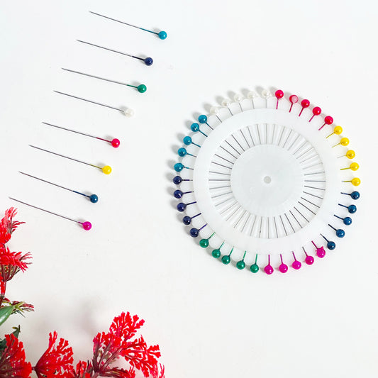 Metal head pins featuring smooth, glossy pearl tops, ideal for securing fabric, designing jewelry, or decorative craft projects.