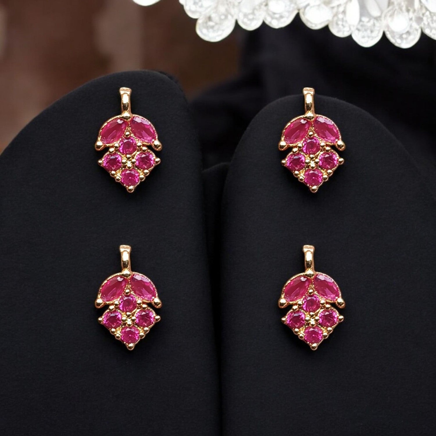 Elegant leaf-shaped pendant embellished with pink AD stones, ideal for necklaces and fine jewelry designs.
