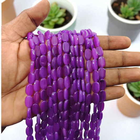 Purple tablet beads with a flat smooth shape, ideal for jewelry making and creative craft designs.