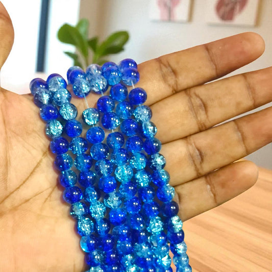 Royal blue and sky blue crackle beads with a glossy dual-tone finish, perfect for DIY jewelry and crafts.