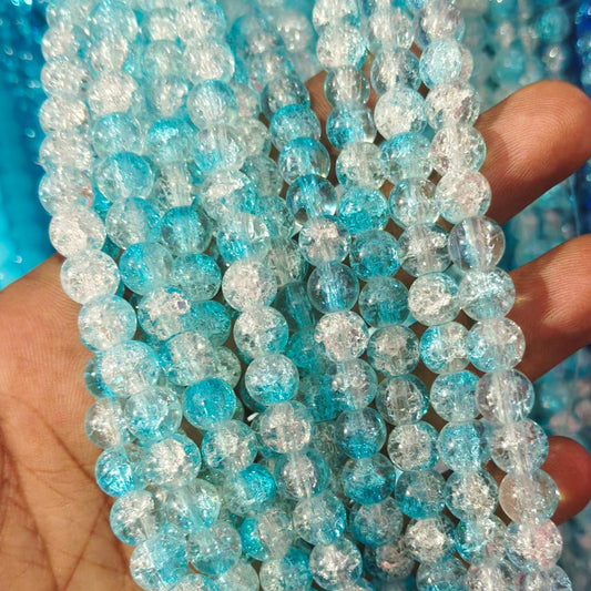 Sky blue and multicolored crackle glass beads with a shiny, fractured-glass effect.