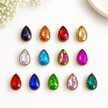 Teardrop Clip Stone with faceted surface and gold-tone border in assorted colours